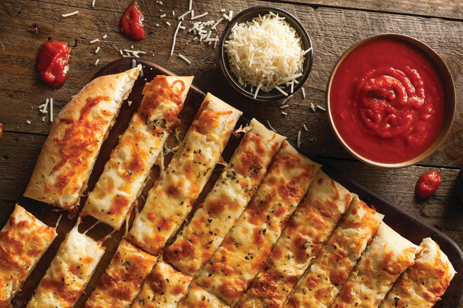 Here’s something simple but scrumptious: cheese sticks made from frozen pizza dough.